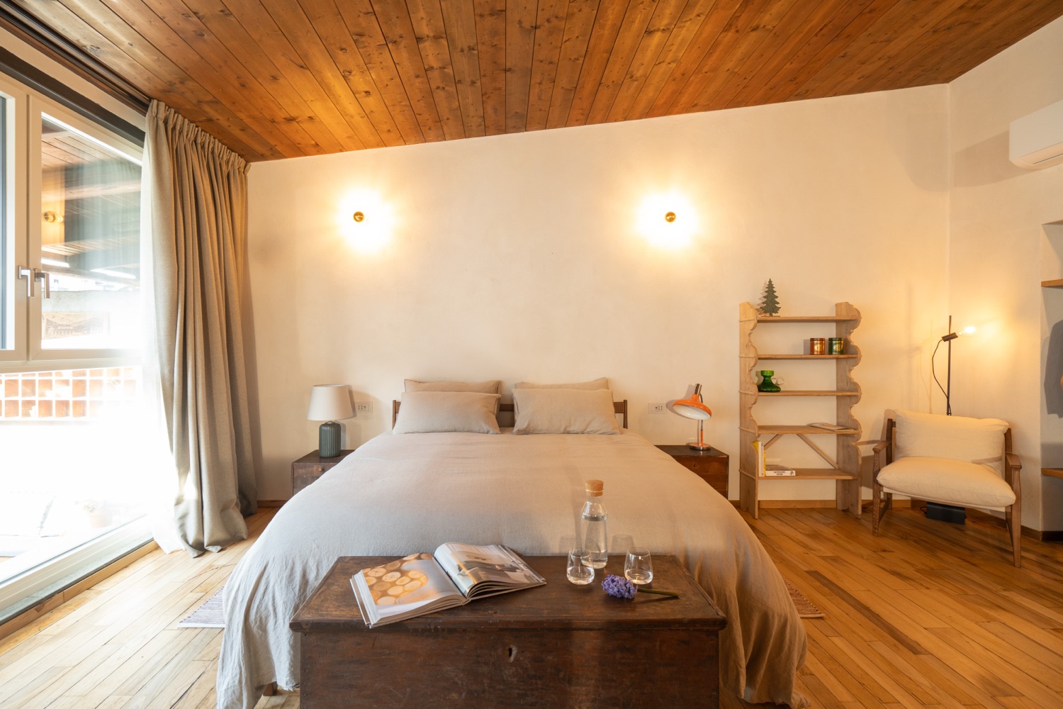 Wooden bedroom with furniture