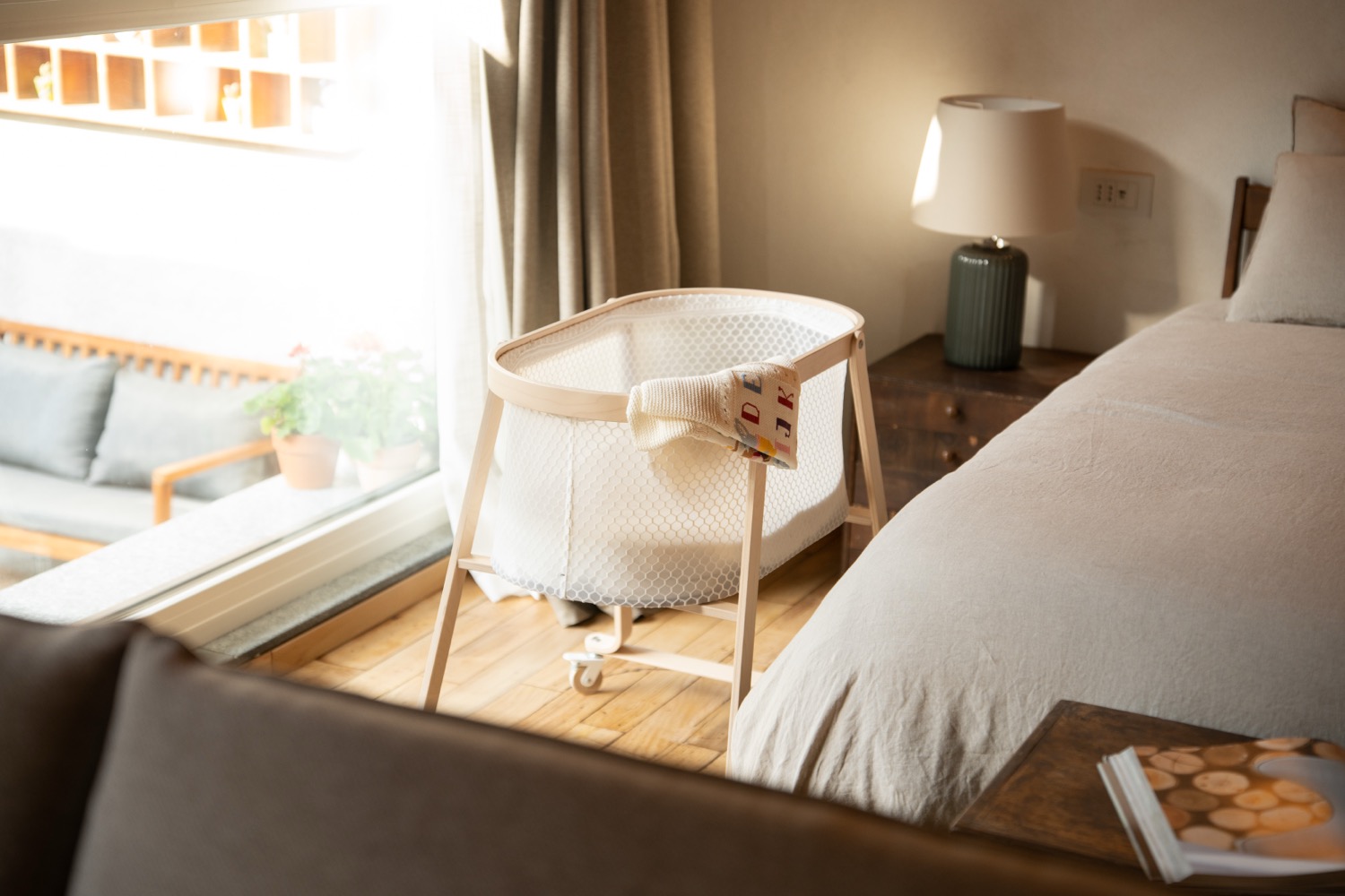 Wooden bedroom with a light lamp and curtains