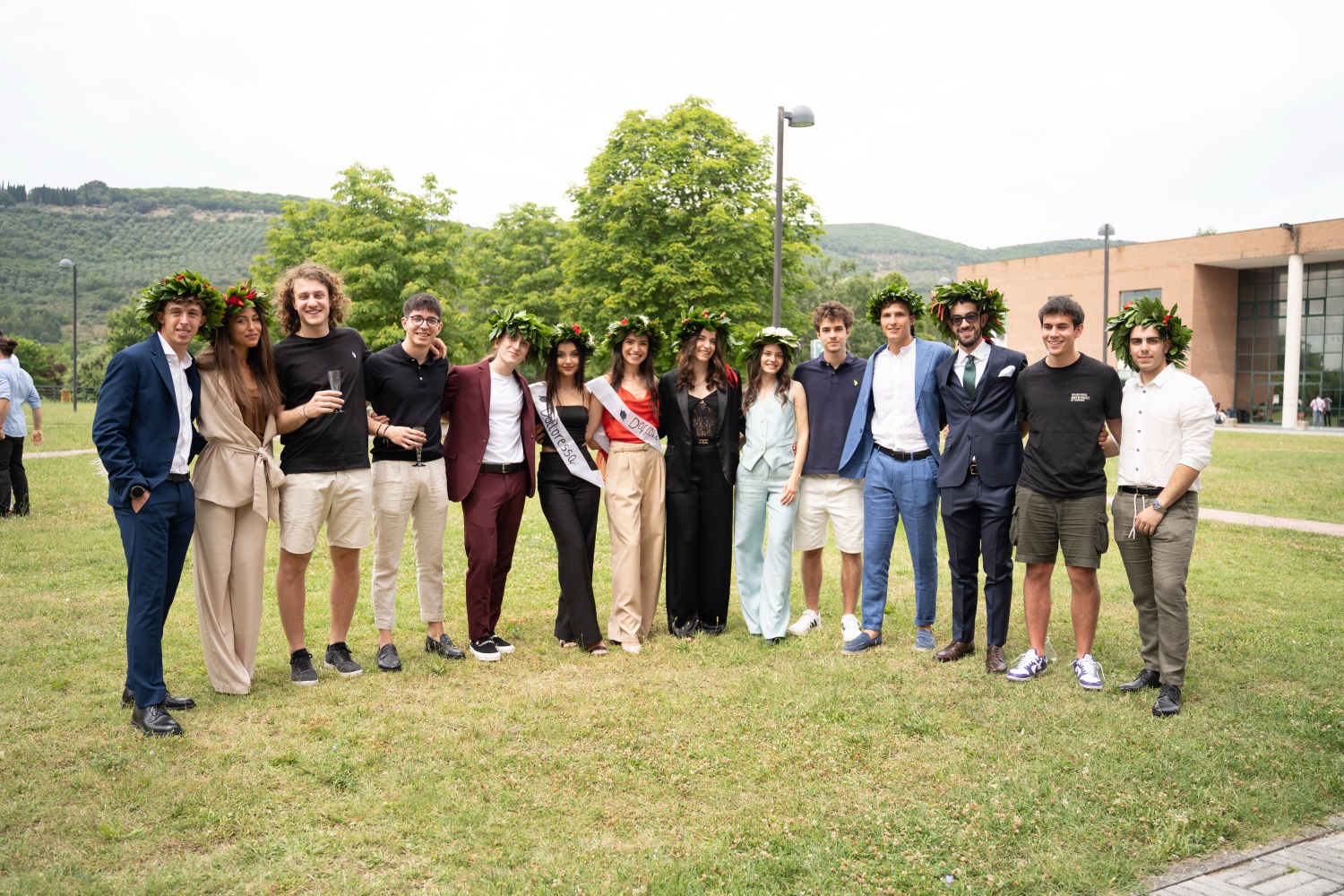 People wearing suits on grassy hill