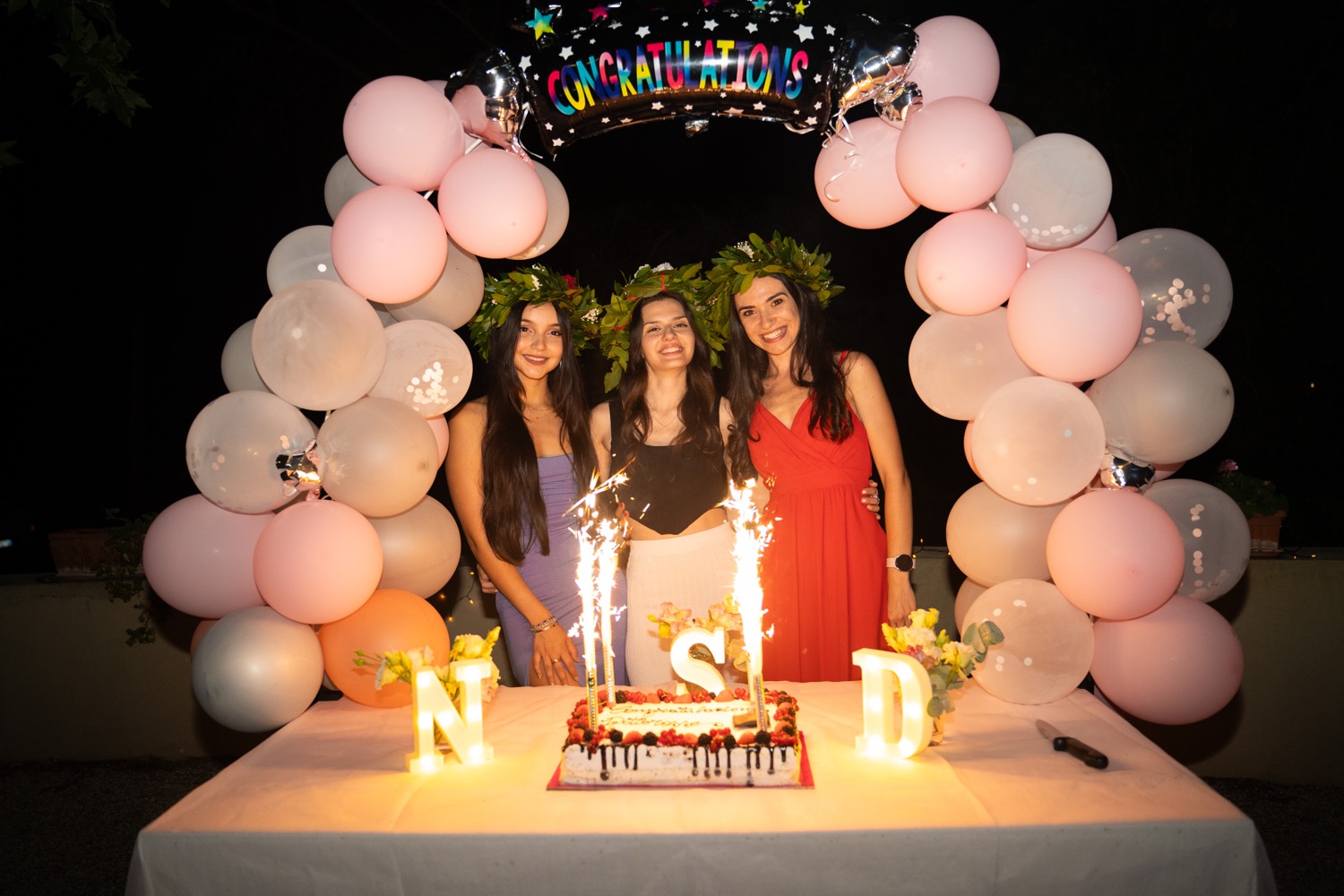 Decorated birthday cake with baked goods