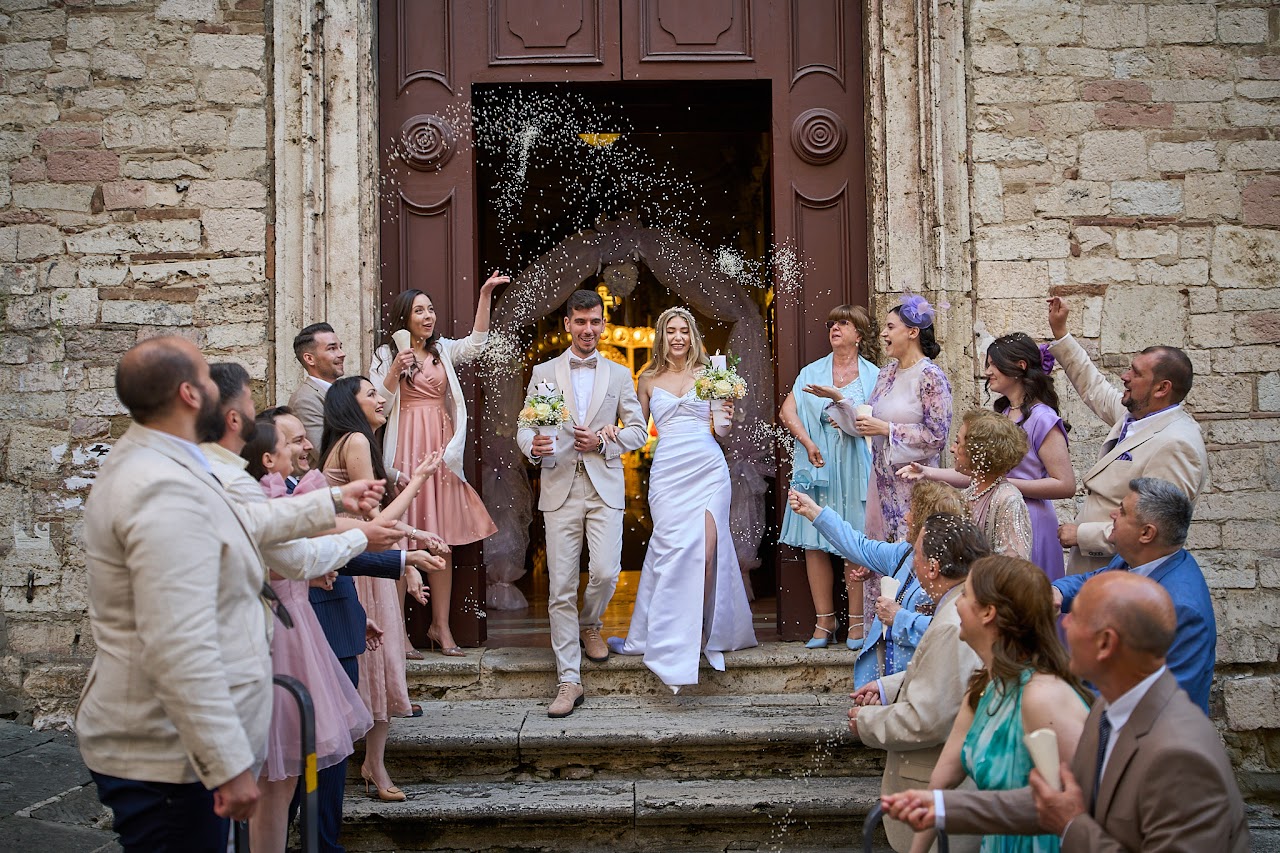 Child in suit stands at door